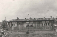 A unique photograph of one of the barracks of the German women’s camp. Jan bought it after the war for the use of the Scout group whose member he had been before the war. Now he was their leader and continued the tradition. These barracks were located on a meadow in front of their house. Nowadays, there are two blocks of flats and two family houses whose construction buried an undeground air-raid shelter which could be entered well into the 1990’s. 
