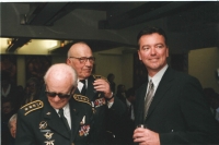 The VIP guests included Jindra Polák, the director of Nebeští jezdci [Riders in the Sky, a 1968 movie].  and those airmen who remembered Ant in person. At the end of the book, there are their personal reminiscences and portrait photographs. Here, from the left: colonel JUDr. Lubomír Úlehla, colonel Jaroslav Hofrichter and Petr Jirmus. He is looking towards the stage where I’m probably talking to the microphone at the moment.