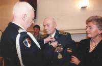Colonel Irving was awarded the National Order of Merit [Ordre national du Mérite], in the grade of Knight, by the French military attaché, in May 1995 in the Legie Hotel in Prague. Colonel suffered from ill health, having been through two major surgeries including a heart bypass. The wounds caused by surgical incisions on his chest were healing badly and caused major pains so his caring wife Blanka had to support him. 
