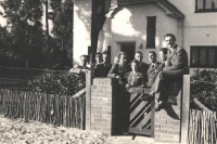 Photograph of the Czechoslovak pilots taken on the 19th April, 1941, in front of the consular villa "Praha: left, P. Hlinovský, employee o the consulate, J. Zdráhal, K. Zeman, O. Žanta, J. Grič, J. Irving, by the gate, the Ambasador's daughter, Stela Linhartová (maried Haisová), third from right, Al. Keda, J. Němeček and A. Sedláček