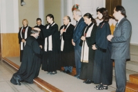 Her husband Miloš Košíček is being ordained as a priest; 1998