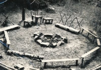 Campfire and seating in the Koloděje summer camp. 1970
