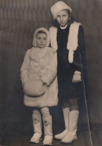 With a sister in a fur coat of domestic rabbits