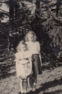 With sister wearing costume at liberation celebration in 1945
