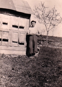 Božena Jurošková´s brother in front of the Baletka farm at a forest clearing in Hošťálková 
