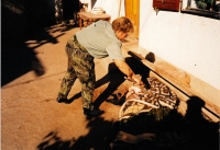 Iva Valdmanova examines a corpse, a mission in Bosnia, Knin, 1995