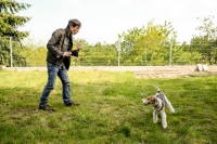 Snapshot of Rastislav Senkirik while playing with his dog
