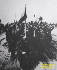 Crossing the border at Dukla - in the foreground a flag bearer Vladimír Kunášek / Source: archive of Václav Širc