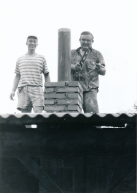 Stanislav Balík and František Pecháček working on the roof the the Scout centre in Bludov