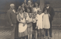 Eva in front of the railway station in Ústí nad Orlicí with her family, 1933