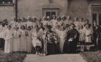Vlasta Vaňoučková with her schoolmates in front of a presbytery - second from the left in the second row, 1940s 


