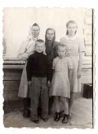 Sofia, Bohdana and Lavrentiya Talanchuk with neighbors at the special settlement, 1953