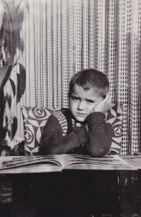 Little Miloš with a book, at home 1953