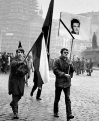 Antonín Podzimek carrying the flag in Jan Palach's funeral procession together with his friend Jiří Janouškovec who is carrying Palach's portrait