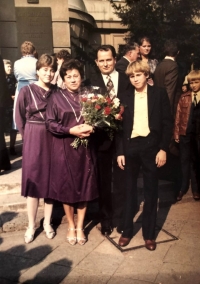 With her family after graduating from university, 1984