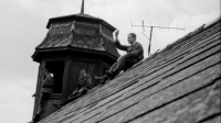 Soldiers watching the passage of occupation troops through Stříbro from the barracks roof and turret; photo by Bořivoj Černý, 21 August 1968 