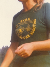 Eva Horová in a T-shirt with a sign "EXILE CZECH & SLOVAK SCOUTING"