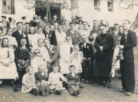 In front, second from the right, sits little Amálie, a traditional wedding party in Šumice, 1940s