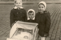 Petr Dujka (centre), sisters Markéta (left) and Monica (right), and brother Michal (in the pram), 1954