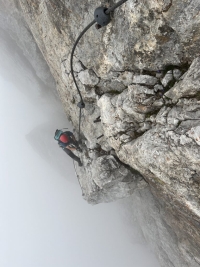 Zikmund Schwarzkopf with his son climbing on the ferrata in the Alps
