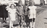 Jaroslav Janešík (second left) with brother Rudolf and sister Marie at the Borovany feast, 1959