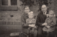 Hana (right) in the arms of her father Ernst Kurzawa, sister Annemarie on her mother's lap, Czermin, 1943