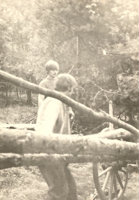 Vratislav Špaček (in the background) during the construction of a log cabin before he joined the army, turn of the 1960s and 70s