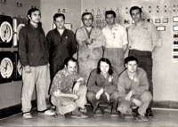 Measurement and control workers at the MAPE control room in front of the measuring instruments in 1974, Miroslav Šmejkal kneeling in the middle