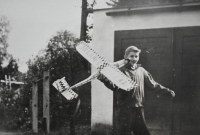 Jiří Bušek with a model of an airplane, Zahradní Street