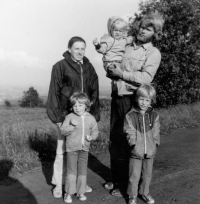 The family: Jaroslav Obročník is cradling his son Jan, son David is standing, and Tereza is with her mother Jitka, circa 1979