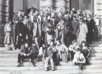 From the celebration of Prof. Libenský's sixtieth birthday - Ilja Bílek in front on the stairs with a briefcase, in conversation with Milan Handl and Stanislava Grebeníčková, Prague 1981