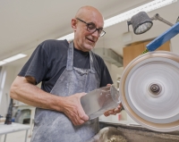 Witness at work while grinding glass sculpture