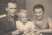 Witness on her third birthday in 1951 with her parents. Soon her father was arrested by State Security