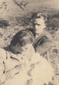 Witness in the arms of her mother and father as a baby in 1948
