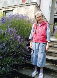 Ludmila Müllerová by her house in Bohdalec, 2024