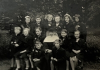 Věra Voženílková with children and a nun from St. Joseph's Shelter