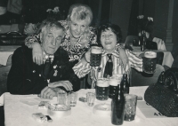 Marie Bílková as an adult with her parents