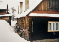 Son Pavlik shovels snow