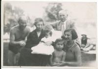 With her parents, grandparents and sister