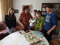 ms. Ingeborg Casarová with children from oral history project Stories of ourneighbors