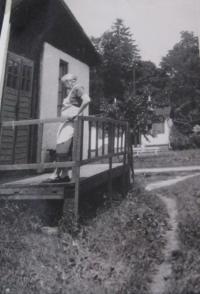 Her mother Emílie Przybylová in front of the quarters in the internment camp in Mohelnice 