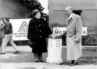 Mr. and Mrs. Haluza by the Běchovice milepost