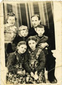 At time of exile. Stand: Mrs. Maria Mykytka, Yurij, Fr. Markiyan, and son Orest. Sit: daughters Aniziya and Lyubomira. Special settlement Kuchi, Khabarovsk krai in the Far East of the USSR, 1953.