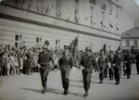 A ceremonial parade - Jan Ihnatík, middle, with the flag