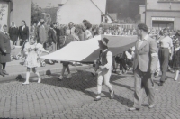 The parade in basketball in 1948. Blanka Andělová carries Slovácké costume Czechoslovak flag