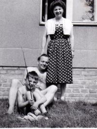 In front of his house at Roztoky with his wife and son, 1958