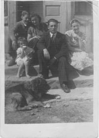 Kristina front of the house with her mother and relatives and a dog Burko, Wola Michowa, 1945