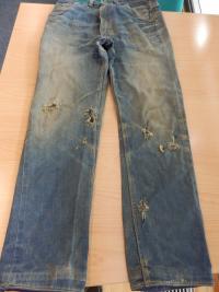 Bullet shots in Petr Šída´s jeans from 21. 8. 1968 (both knees and shin on his left leg)