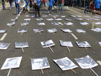 Photos of disappeared persons laid on the street on the occasion of the military putsch anniversary (24/03/2016, Buenos Aires)