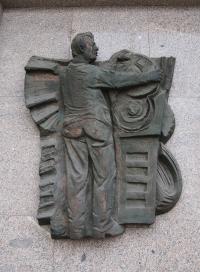 Relief "Modern production" on the building of Regional Committee of Communist Party in Pilsen, author: Alois Sopr